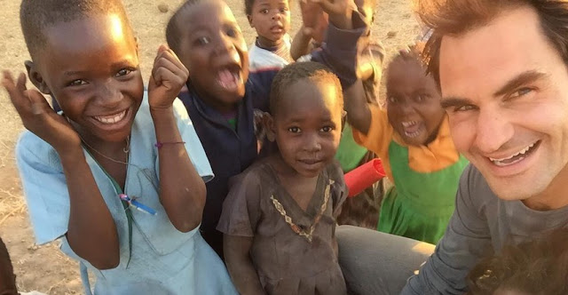 Roger Federer Posing With Thrilled African Children